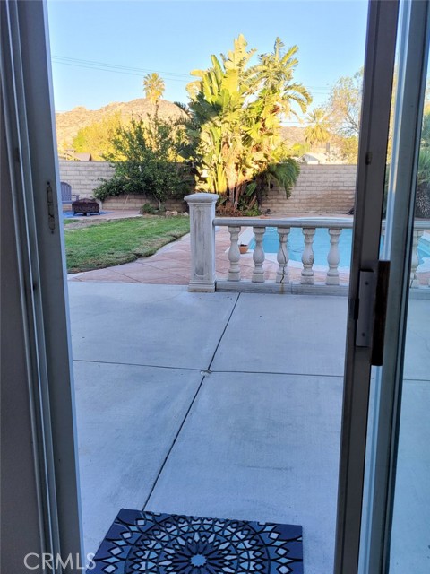 Slider door to backyard patio and pool