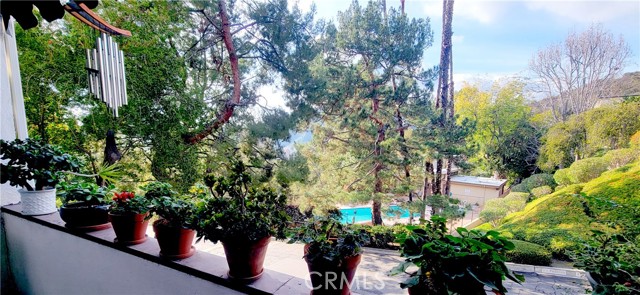 Balcony with mountain and pool view