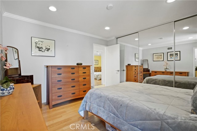 Full Mirrored Wall Closet in Primary Bedroom