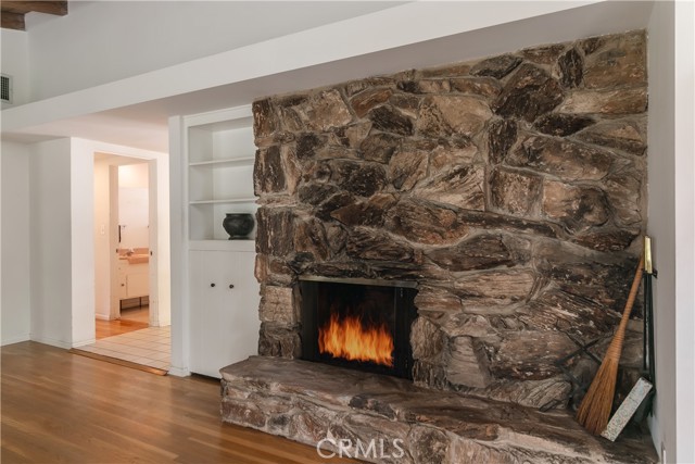 Fireplace with raised hearth.