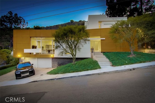 2271 Betty Lane Beverly Hills, California On a ~12k square foot flat lot sits an architectural modern masterpiece located in the highly sought after Beverly Hills Post Office. Be taken back as you enter the home to find an industrial dream designed with floor to ceiling glass walls that showcase the expansive backyard & allows an abundance of natural light. Large living room with 12’ ceilings & polished cement floors, formal dining area with pictured windows & wide gallery walls perfect for artwork. Chef’s style kitchen with an enormous island, breakfast nook & so much storage you will be left with empty cabinets. Family room off kitchen offers 21’ ceilings overlooking the yard. Main floor also offers a bedroom with an en-suite, gym, office & bonus room that can be used as a guest bedroom or creative room. 2nd floor consists of the primary suite w/ a walk-in closet as well as built-ins, 3 secondary bedrooms & a bonus/game area. Now step outside to an entertainer’s backyard with lush landscaping, covered patio perfect for outdoor dining, a swimmers pool, pool house & outdoor bathroom with shower. This is one you definitely don’t want to miss!