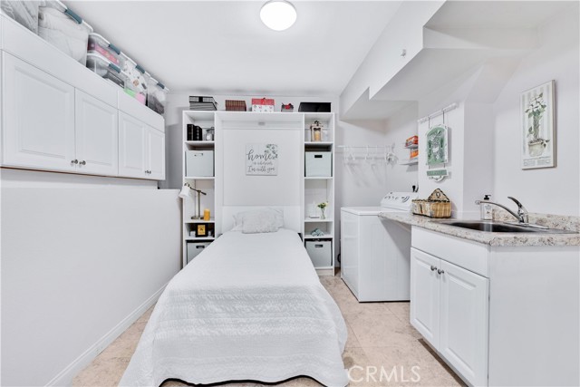 Over-Sized Laundry/Storage room with Murphy Bed.