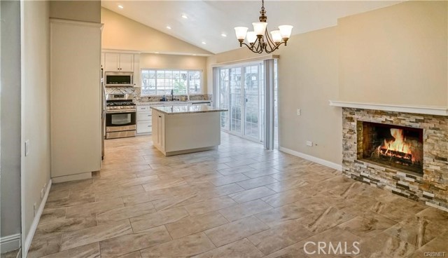 Open and newly updated Kitchen with adjacent dinning area and cozy fireplace