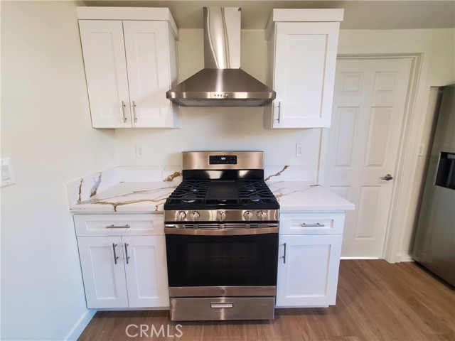 Upgaded stainless steel appliances and hood.