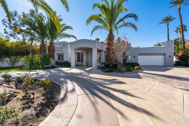 71545 Sahara Road Rancho Mirage, California A beautiful 4-bedroom, 4-bathroom home in Rancho Mirage is fit for a royal! Boasting 2,700-sqft, the circular driveway and palm trees are reminiscent of a beachfront resort. Inside, the vaulted ceilings are paired with stone tile floors highlighted by the lovely ambient light streaming through for a wonderful sense of grandeur. The gorgeous kitchen comes equipped with dark wood cabinetry, stainless steel appliances, a handy kitchen island in the center, plus a cozy fireplace near the breakfast nook. The spacious garage has been converted into a massive game room that's perfect for entertaining guests. In the primary bedroom youll find a handsome fireplace, walk-in closet, and patio doors to the backyard. The primary bathroom features dual vanities, a large shower, and tub. Out back youll discover a paradise awaits you: a covered patio, appealing pool, outdoor BBQ pit, and kitchen. Plus, your own gazebo & plenty of trees allow for great privacy. Located nearby College of the Desert, Westfield Palm Desert, Trader Joes, Target, and more!