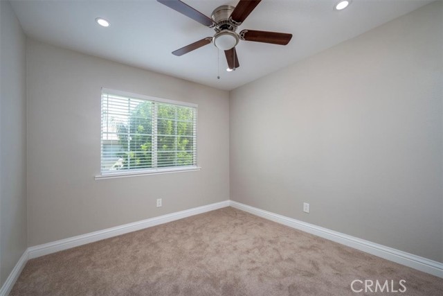 Upstairs fifth bedroom, upgraded ceiling fan, recessed lights & plush carpet