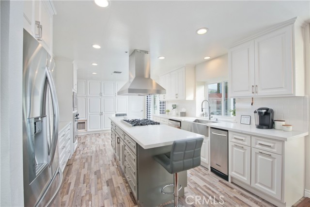 Custom built kitchen with wood soft-closing cabinetry, quartz counters, recessed lighting