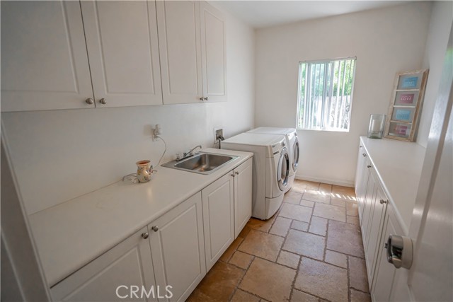 Laundry Room with Sink and Ample Cabinets