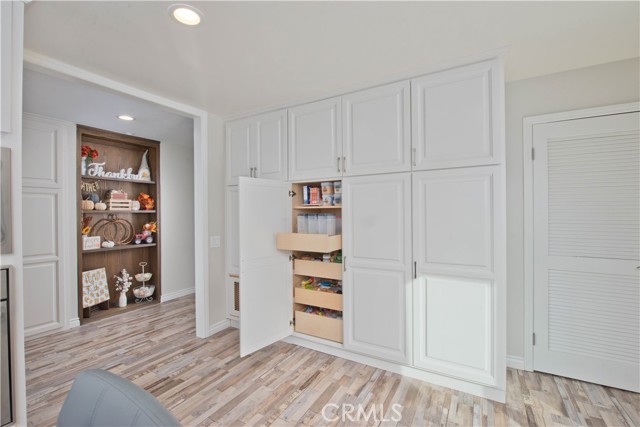 Pantry wall with custom pull-out cabinetry.