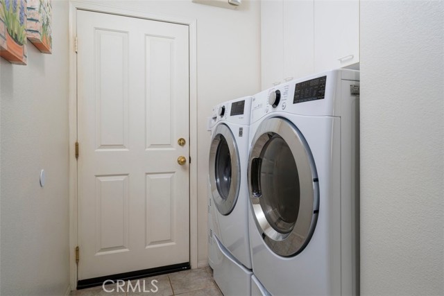 In door laundry room with sink