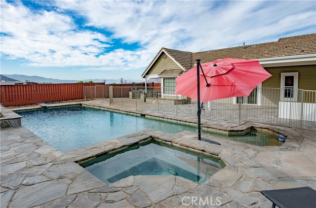 Sparkling swimmers pool with a shallow kids area, and a jacuzzi