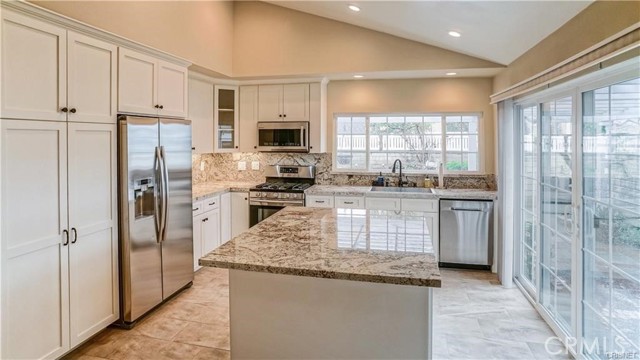 Lots of natural light, sloped ceilings with recessed lighting and ample cabinet storage space