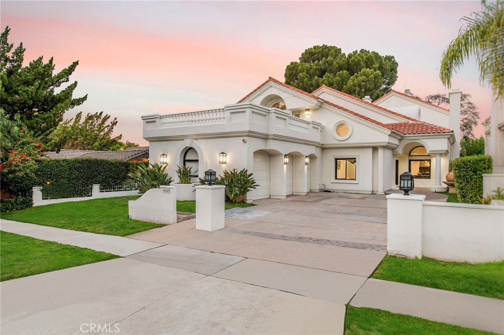 14065 Valley Vista Boulevard Sherman Oaks, California Boasting airy, grand interiors brimming with luxurious design features, 14065 Valley Vista Boulevard is a refined, newly renovated five-bedroom, five full and two half-bath villa, set across 5,918 square feet, located south of Ventura Blvd in prime Sherman Oaks. Inside, find expansive living spaces accented with high vaulted ceilings and illuminating, architectural skylights. The main-level great room opens to a dramatically designed central curved staircase and a grand dining room. Nearby, the large, modern kitchen features porcelain counters and backsplashes, custom cabinets and high-end appliances. Ascend the curved staircase to the 1,000-square-foot primary suite with soaring ceilings, a chic sitting area with full wet bar, a double-sided fireplace, a walk-in closet with custom built-ins, and a stunning spa-like bath steeped in black marble with a standalone soaking tub and steam shower. The backyard provides a beautiful setting for open-air hosting with an elevated covered patio that overlooks a pool and lawn. Additional home features include a large, tiled second-level terrace off a bedroom with treetop views, a 3-car garage, plus driveway parking. Just a few blocks away from Sherman Oaks best shops, restaurants, Buckley School, Erwon, and new Equinox.