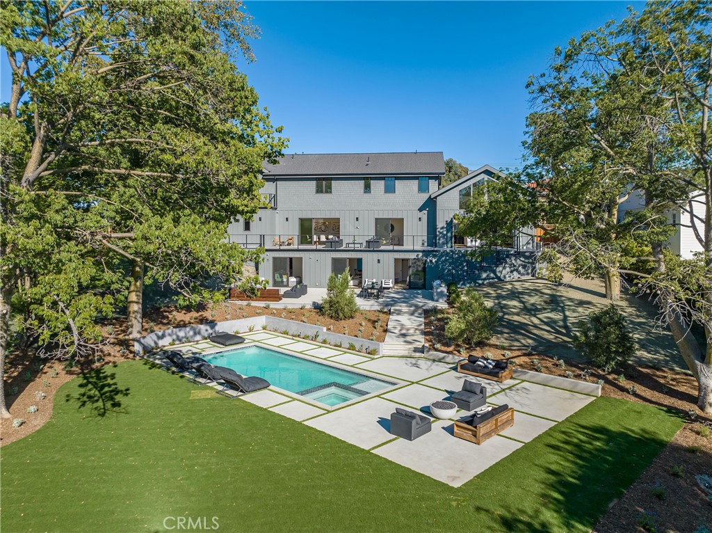 One-of-a-kind NEW 2022 CONSTRUCTION! This rare flat usable 26,000 sq ft lot is one of the largest lots in Bel Air! No detail was spared in this incredible 7,000-sqft two-story home with modern touches and elegant detailing featuring White Oak floors throughout, Carrera marble in all bathrooms, an indoor-outdoor feel from the living room, and dining room featuring glass doors that open up to the patio, and fire pit perfect for entertaining. Luxury is redefined in the gorgeous primary bedroom with an incomparable closet and an en-suite bathroom to rival any five-star hotel. Additional bedrooms are generous in size, perfect for guests. Outside, the possibilities are endless with a brand new pool and attached spa, a fire pit, and a large flat grassy area perfect for a basketball court or tennis court! This gorgeous home is built to perfection! A must-see!