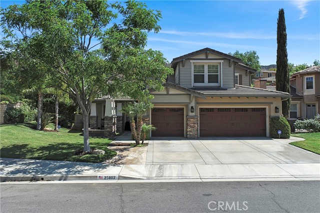 25802 Royal Oaks Road Stevenson Ranch, California Amazing Southern Oaks Pool Home! Many upgrades throughout. Located on a sprawling corner lot w/ great curb appeal. When you enter this fantastic home, you are greeted by an open inviting Living Room w/ High Ceilings & plenty of windows for natural light. The Remodeled Kitchen features Granite Counters, Center Island, designer mini-Versailles tile backsplash, upgraded appliances, Built-In Refrigerator, Antique brushed nickel hand-hammered copper farmhouse sink, Quoizel Nobel five light rustic black chandelier & plenty of cabinets. Large Family Room w/ built-in Entertainment area + Fireplace w/ raised Hearth. A bedroom w/ full bathroom on the first floor. Hickory engineered Hardwood flooring in the Kitchen, Family Room & Downstairs bedroom. Versailles pattern tile floors throughout the Living & Dining rooms w/ matching Tile floors in the Bathrooms. Crown Molding & Plantation Shutters throughout. Wired Speakers in every room. The Maple & wrought iron bannister leads you upstairs towards the multi use Loft. The Large Master bedroom en suite w/ coffered ceilings, features his & hers vanities & walk-in closets, Spa tub + separate shower. Minka Aire ceiling fans in three bedrooms + the Family Room. The Spacious back yard is a true Oasis and offers privacy w/ a Pool, Spa, Built-In Barbeque, Lush landscaping, Outdoor Fireplace, extensive LED Kichler lighting, Wired SpeakerCraft outdoor audio speakers, Pentair Intelliflo 2 VST high efficiency variable speed pool pump + Brass outdoor Light fixtures. Three Car garage w/ wall to wall cabinets, work bench, heavy duty steel frame overhead storage rafters, upgraded lighting, additional electrical outlets, upgraded insulated garage doors w/ wall mounted WI-Fi garage door opener + back-up battery. Hard wired security alarm system w/ two control touch screens panels + four surveillance cameras. Ring doorbell, Emerson SENSI Touch Smart thermostats. Picturesque Front yard landscaping w/ LED Kichler lighting. LED timer/manual light switches for all outdoor light fixtures & Front Porch recessed lighting. Sunrun Solar Panels & so much more! Located near award winning school, parks, hiking trails, shopping, Community Club House, Pool & Tot lot & No Mello Roos.
