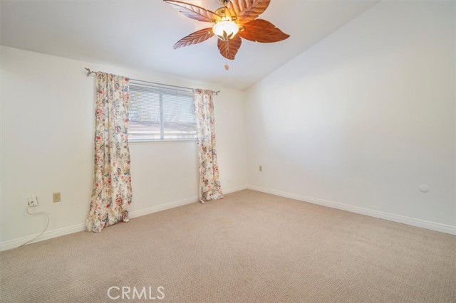 Primary bedroom with ceiling fan