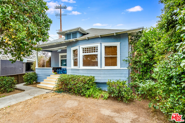 1163 Nelrose Avenue Venice, California Circa 1914 craftsman style bungalow home just east of Lincoln Boulevard in Venice. The property features a large open dining room/living room with wood floors, coved ceilings, and a built-in hutch. Large, eat-in kitchen opens from the dining room. Three bedrooms and two baths. The house needs work but still retains much of the original period features and charm like coved ceilings and built in cabinets. Large back yard with parking off the rear alley. Huge producing grapefruit tree in the front yard. The lot is zoned RD1.5 and is just under 4,300 square feet in size. It is bounded by two alleys making it an easy site to develop.