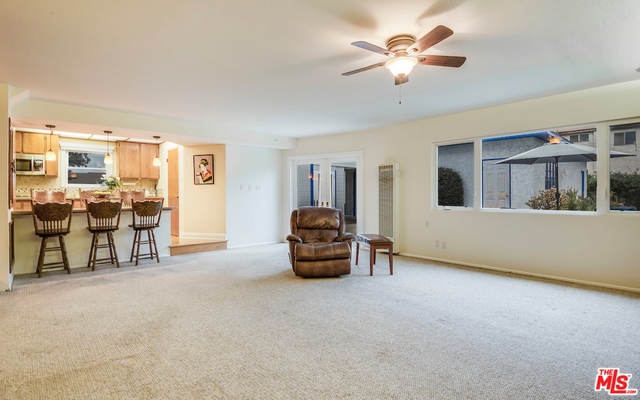 Family room is perfect for grings wi french doors extending e party to e outside