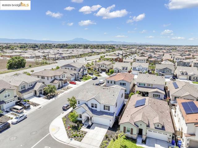 Aerial perspective of suburban area featuring a mountain backdrop