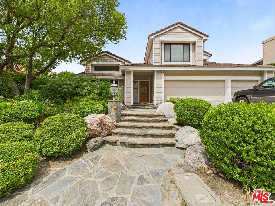 Welcome to this beautifully upgraded 5-bedroom, 3-bathroom home featuring a versatile loft and a fully insulated home theater. Enjoy sweeping 180-degree views of the Santa Clarita Valley from the kitchen, family room, and primary suite. The open-concept layout is perfect for entertaining, with a chef's kitchen boasting stainless steel appliances, Viking stove, double oven, travertine floors, sleek glass backsplash, and a butcher block island.Upgrades include paid-off solar, new double-pane heat-resistant windows, dual-zone A/C units, a 2024 water heater, new central vacuum, and durable HardiPlank sidingfire and termite resistant. The primary suite offers panoramic views, a spa-like bath, and dual walk-in closets. A spacious loft provides flexible use for an office, gym, or playroom. Upstairs laundry (washer/dryer included) adds convenience.Enjoy resort-style HOA amenities including two tennis/pickleball courts, a pool, RV parking, and two private parks. Located on a cul-de-sac with direct access to hiking trails and just minutes from top schools, shopping, dining, and the 5 Freeway.