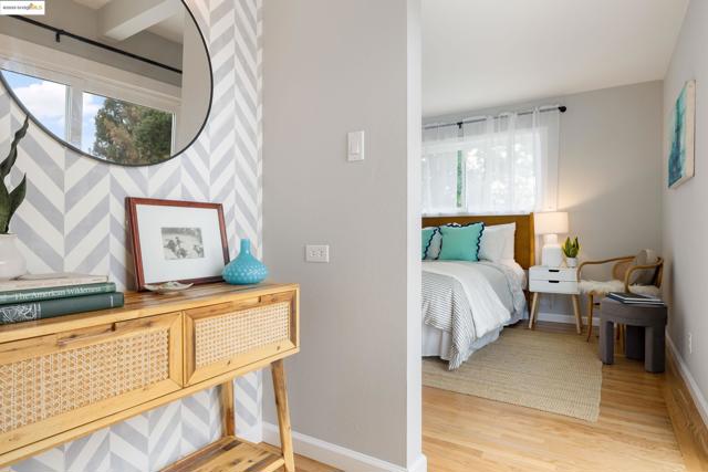 Bedroom with light wood-style flooring and baseboards