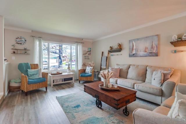 Big living room with oversized front window allowing for an abundance of gorgeous natural light!