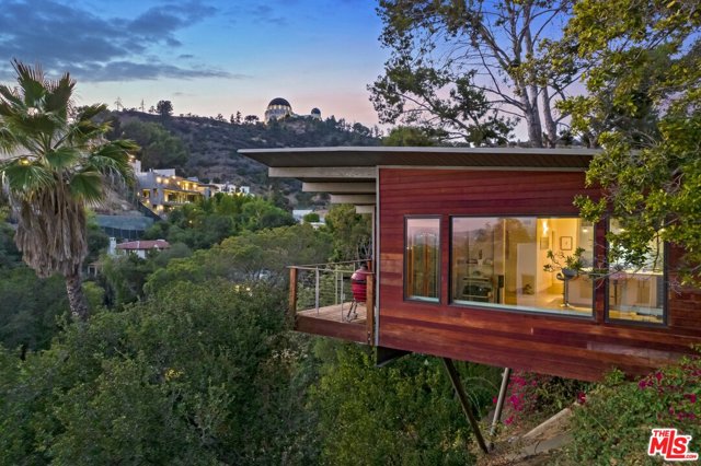 2515 N Catalina Street Los Angeles, California Want to live in the coveted Los Feliz Hills for under $2M? Come fall in love with the views from this 1961 Mid-Century Modern post-and-beam. An easy drive up Catalina takes you from a neighborhood full of shops and restaurants, past some of the most beautiful Spanish Colonial estates in LA, and right to this sweet 2 Bed 2 Bath with a side yard. On clear days, you can see all the way to the Pacific; every night, you can fall asleep looking out at the city lights. Whats more, the home is perched right under the Griffith Park Observatory -- each window offers a different and dramatic view of this iconic LA landmark.Recently reimagined with smart, modern features that take nothing away from its bold, captivating architecture, the home is ideal for those that enjoy walking and hiking through Griffith Park. Two entrances are within short distance, and the Observatory itself is only 20 minutes away on foot. The current owners regularly walk to dining on Hillhurst and Vermont, and appreciate the close-knit, community feel of one of LAs most stunning hilltop neighborhoods.The property includes off-street parking for three cars, dual-paned casement windows throughout, and potential to add value in the side yard (pool, ADU, deck). This is not one to be missed!