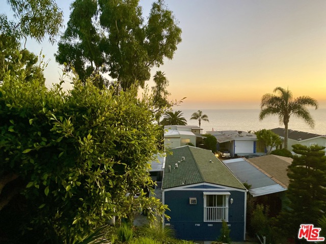 9 Copra Lane Pacific Palisades, California Move in Ready ! A traditional beach house of exceptional quality and beauty in an unbeatable location. Steps from the beach, affordable, 2 bed / 2 full bath, breathtaking mountain views on a quiet side street. An abundance of natural light, high vault ceilings, artistic fixtures and craftsmanship throughout the home. Open family and dining room layout offers numerous gathering places and promotes an easy flow. The upgraded kitchen features a L-shaped island breakfast bar area with custom built-ins, new dishwasher and appliances included. Indoor Laundry room. The large master suite has combined tub and shower, opens to a lush landscaped garden setting which creates a calm ambiance with side patio garden area and outdoor storage. Two-car parking in attached carport. The Clubhouse has a heated pool, hot tub, exercise gym and table tennis. No HOA fees or property taxes. Space rent to the new owner approx. $1508.00 per month. Loans are available.