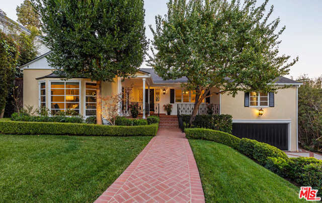 1240 N Wetherly Drive Los Angeles, California Private Lower Doheny Estates -1948 traditional gated property in park-like setting on over 1/3 acre. Sited in coveted location N. of Sunset easy access to all. Wrap-around front porch leads to B&W marble entry & LR w/ French windows, crown moldings & wd burning FP. FDR incl seating for 12 & pocket doors leading to the heart of home: open FR w/ FP, informal dining area & chefs kitchen w/ prof appliances. Principal BR suite w/ vaulted ceiling, walk-in closet, BA with steam shower, heated floor & spa tub; adjacent are 2 lg size BRs (one w/ built in desk & shelves) sharing full BA; off kitchen is walk-in pantry, laundry & separate suite - for office, guest, live-in.Lower level incl sep office w/pvt entry, French doors,built in shelves & Gym w/BA 2 lg storage rooms &world class wine cellar. Entire house opens to spacious garden, patios, gazebo & lg pool perfect flow for yr round entertaining & living. Superb
