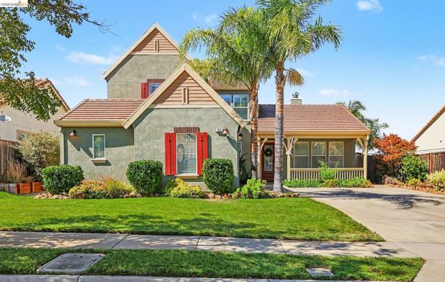 Stucco exterior with decorative wood gables and red window shutters