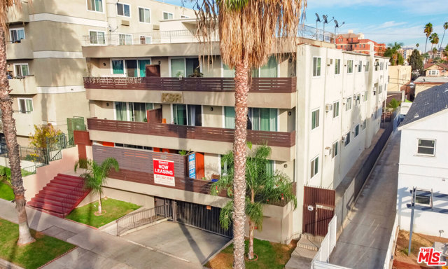 932 S Westmoreland Avenue Los Angeles, California $200,000 PRICE REDUCTION! 932 S Westmoreland Ave is a 32-unit, 3-story, value-add apartment building located in the highly desirable Mid-Wilshire submarket of Los Angeles. Constructed in 1964, the building has a unit mix of 12 bachelor, 5 single, 12 (1+1), and3 (2+1) units averaging approx. 550 sqft, and 15 of the units (47%) have been upgraded over the years. The 20,445 sqft structure sits on a 10,700 sqft, LAR4-1 zoned lot. The roof was replaced in 2020, a new elevator was installed in 2019, new windows (building-wide) in 2018, and the parking garage features a new gate motor. The main entry, lobby, hallways, and common area lounge feature updated lighting. The rear yard common area includes a patio and elevated deck furnished with tables and chairs. The security system consists of 16 cameras and 4 Ring cameras placed throughout the property. Secured garage parking holds 27 spaces. The building is separately metered for electric, master metered for gas + contains a new master boiler.