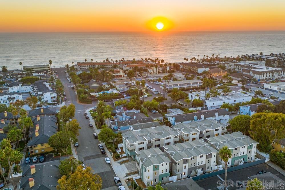 358 Walnut Ave Carlsbad, California Rare Find! Spacious 4-bedroom 3.5-bath luxury coastal beach house just two blocks from the sand and just south of charming Carlsbad Village's gourmet restaurants, shops, farmers market & year-round events! This spacious elegant end-unit townhouse offers a light open-air floor plan filled with upgrades & amenities! There's even an EV Charging Station & Solar Panels! Enjoy the sophisticated coastal lifestyle! There is a generous bedroom w/full bath at entry level. The second level features a large great room w/ wood flooring open to a gourmet kitchen loaded w/ upgrades including stone countertops, designer tile full backsplash, white shaker style cabinets with custom pull out drawers, high-end stainless-steel appliances, and a custom alkaline water system. Step outside the great room and relax and enjoy ocean breezes on your spacious private balcony. The main level also offers a laundry room with full sized top of the line washer and dryer and a guest half bath. Ascend upstairs above the main living level & you will find three additional bedrooms, including the large primary bedroom featuring a spa-style bathroom with shaker-style double vanity, quartz countertop, a large spa-style soaking tub, separate shower & separate room with sink, toilet w/bidet. There is also a large walk-in closet with custom built-in shelving. The other full upstairs bathroom offers lux stone flooring, decorator fixtures, spacious shaker style double vanity with quartz counter tops, & designer tiles in tub /shower . Some photos are from similar model home. Actual Bedrooms have lux carpet flooring.