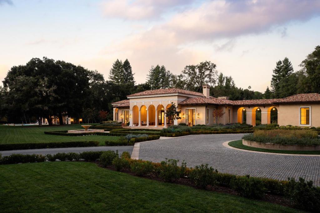 Villa del Prato is a singular gem among Silicon Valley estates. Nestled in the woodlands of Portola Valley on nearly 12 acres of tranquil, private, flat land, the estate comprises three structures: a main house (12,000 sf); an entertainment or business building (6,500 sf); and a pool house (2,000 sf).  Inspired by classic Palladian Italian architecture, each structure is reminiscent of a Tuscan villa, featuring soaring arches, 20-foot ceilings, dramatic skylights, solid stone columns direct from Italy, and the finest-quality finishes. The main home, built on two levels, features a one-of-a-kind 900-square-foot dressing suite that doubles as a safe room. Unseen are advanced systems for the comfort and security of residents and guests.  The entertainment/business building provides an opportunity for customization. With its towering columns, airy loggia, and spacious ballroom, it could be utilized for entertaining, as a home office, conference center, staff housing, or a home for your next startup. Electrical, plumbing, HVAC, and other key systems are fully fitted out.  This grand estate is centrally located close to Hwy 280 mid-way between San Francisco and San Jose, with easy access to major airports and technology and business centers.  (All sf info per plans).