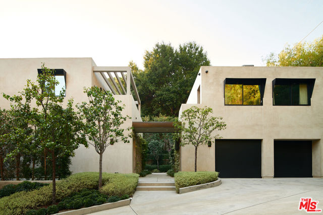 1317 Delresto Drive Beverly Hills, California Warm and sophisticated, 1317 Delresto Drive greets you at the end of an ascending, privately gated drive, tucked in a 1.1 acre Beverly Hills hillside estate. 6 beds, 9 baths, a primary suite with dual walk-in closets, dual baths, a fireplace, a vanity room, and resort style grounds with a pool, spa, built-in BBQ, seating area, and manicured gardens. The crafted home offers open living spaces of designer finished walls, imported stone, fine oak flooring, contrasting accent details and full length sliding glass doors to reveal the serene lush surroundings for a powerfully elegant ambiance.Each stunning detail contributes to the rare blend of style, privacy, and tranquil city living.
