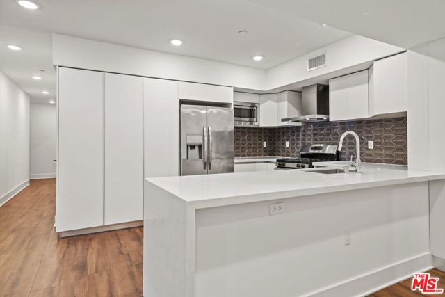 1223 Wellesley Avenue, Los Angeles CA: https://media.crmls.org/mediaz/02642e93-a28a-483b-bf76-cefaa37502c0.jpg