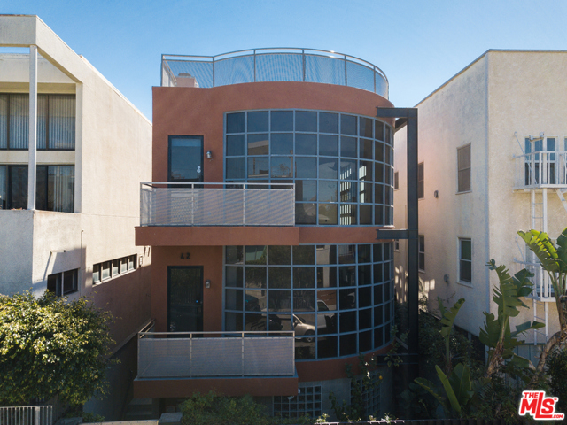 42 Brooks Avenue Venice, California This Beautiful vacant 3 Bed, 2 Bath One story Beach condo is part of a private 2 unit Condominium building & being sold with the other vacant 3 Bed, 2 Bath One story condo Unit #1 @ MLS#21-713086. There is an additional common area rec room per the permit file (See Permit File In Docs). Located at the beach in World renowned Venice Beach California. Very clean well maintained enclosed security building in move in condition. Enclosed Secured Garage parking for 6 cars (3 cars per unit) and lots of storage space. Elevator access direct from garage to unit. Very spacious floor plan, filled with lots of light, some ocean view, fireplaces in living room & master bedrooms, private patio, large master bath w/ Jacuzzi tub, separate shower & large walk in closet. Spectacular Roof Top Deck with Ocean, Mountain & City Views. Very unique opportunity to buy both units at the beach, live in 1 unit, rent out the other & options with the additional unit located on the 1st level. Located in Silicon Beach one of the hippest most sought after areas where you can walk to the beach, enjoy shopping and dining on famous Abbot Kinney Blvd. Close to the neighboring communities of Marina Del Rey, Playa Del Rey, Santa Monica & West Los Angeles. (See Permit File In Docs)