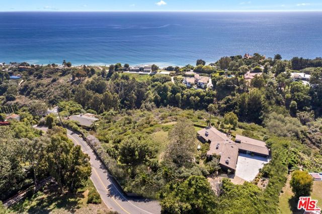 Welcome to 22042 Carbon Mesa Rd, just two minutes up from the beach & the PCH your tranquil, private compound. Set in the best location, minutes away from Cross Creek, PC Greens Malibu, Nobu & Soho House. This recently renovated residence is sprawled across 2.8 acres overlooking Billionaires' beach. Enjoy panoramic ocean views from the Santa Monica shoreline to Catalina Island & beyond. Live the good life in this traditional, 3-bed, 3-bath ranch home, your quintessential Malibu getaway. Complete w/3 fireplaces, fire pit, huge grassy lawn, motor court with room for 8 cars and 2-car garage. A detached 2-bed, 1-bath guesthouse is perfect for use as an office, studio, or maids. This stunning hillside estate includes a membership to the exclusive La Costa Beach & Tennis Club. Breathe in the fresh air and watch the sunset on the horizon overlooking the most breathtaking strip of coastline in the world. This serene retreat is what Malibu living is all about.