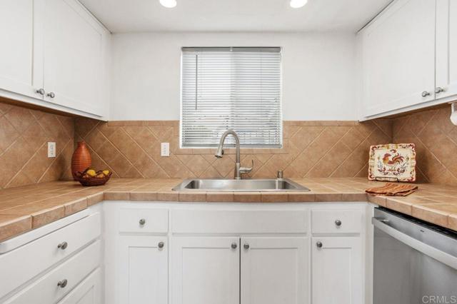 New stainless sink, faucet w/sprayer & garbage disposal