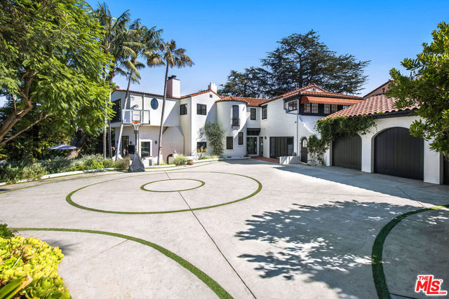 2789 Mcconnell Drive Los Angeles, California One of the largest properties in Cheviot Hills set on an oversized TRIPLE prime lot lined with palm trees, this Santa Barbara style, fully renovated Cheviot Hills estate is your own one-of-a-kind sanctuary w/ views of Dtla & the Hollywood sign and a private 8-car driveway entrance. 5 minutes from Beverly Hills, Century City & freeways. Historical significance & modern luxuries culminate in this rare pedigreed home. Gated with a large motor court, a dramatic foyer leads to sensational interiors w/ exposed beams, Venetian matte plaster walls throughout, white oak floors, wood-accented bar, cinematic fireplaces, & stunning chandeliers. The gourmet kitchen is outfitted w/ open floor plan & top-of-the-line appliances, including a Sub-Zero fridge, tile works & large windows for natural light. Large steel-cased windows unveil a resort-like outdoor entertaining oasis with expansive grassy yard, mature trees, pool/spa, & lounge areas. Upstairs features 4 en-suite bedrooms w/ sweeping views of the mountains to the city. The primary suite features a luxurious home-spa w/ heated bathroom floors & a sizable soaking tub facing the verdant vista. Large basement w/ bed, bath, & washrooms. The guest unit can be made into a perfect home office or gym. An opportunity to own a home this caliber rarely comes to the market & wont last long.