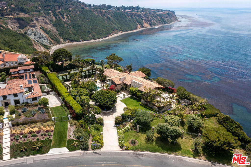 For the first time in 50+ years, a rare 250 feet of bluff frontage overlooking Malaga Cove. The flat 42K lot boasts explosive & unobstructed 280-degree ocean views. This 1970s custom-built home showcases meticulous millwork throughout, impressive 14-foot vaulted ceilings, and offers breathtaking water views from every room, making it a truly unique and picturesque property.  A championship Tennis Court, resort-style swimmers pool, and motor court entry create endless possibilities at this once-in-a-lifetime estate.