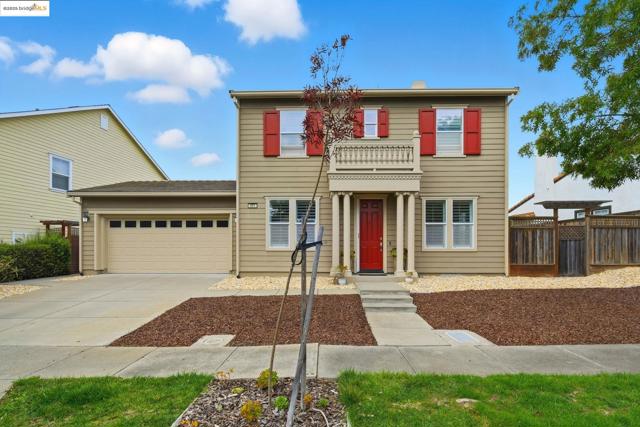 View of front of property with driveway and a garage