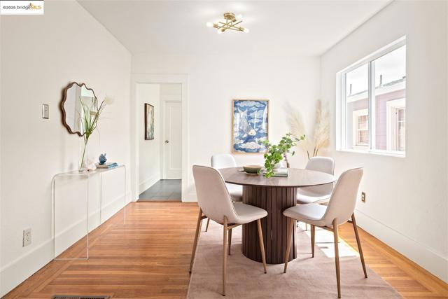 Dining space featuring light wood-style floors and baseboards