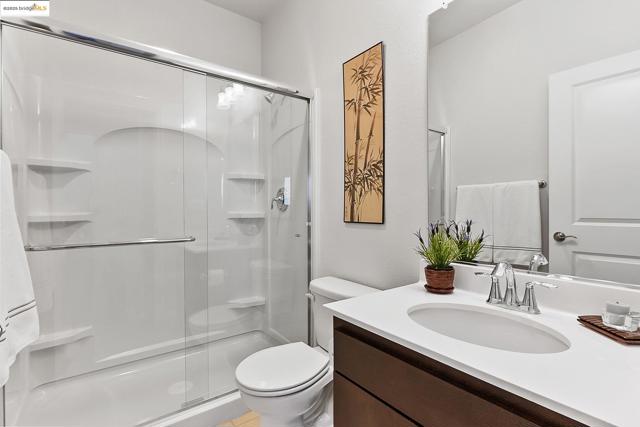Full bathroom featuring a shower stall and vanity
