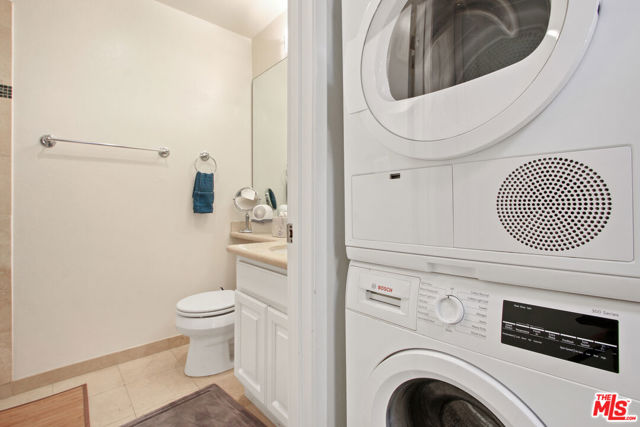 Laundry outside of second bathroom