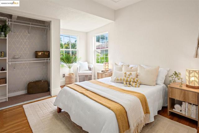 Bedroom featuring wood finished floors and baseboards