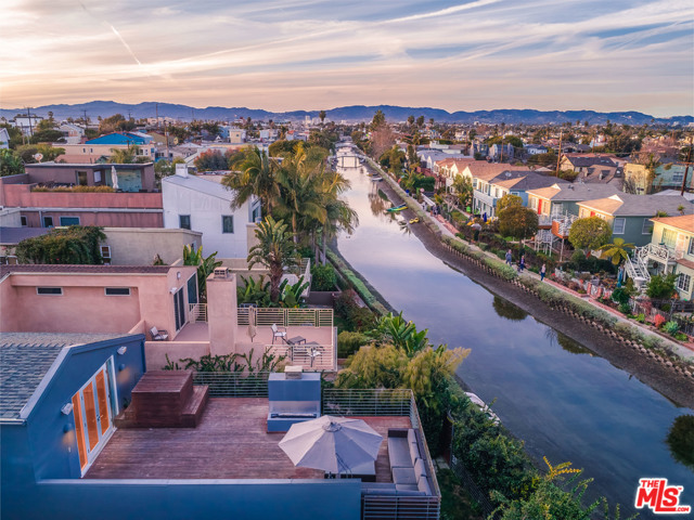 3001 GRAND CANAL Venice, California The ultimate Venice Canals home is finally available for you! Boasting probably the best sweeping views of the Venice canals, this architectural home has everything you need to fully immerse yourself in the Venice lifestyle. Minutes to the sand, Venice boardwalk and of course, the world-famous Venice Canals. This home features a spacious 2 car garage (2 car driveway as well for your guests) with ample cabinet space. The amazing custom kitchen features top of the line appliances, dual sinks and breakfast bar with a great open layout into the large living/TV area. Wonderful dining room leads into a full bar with more space for your entertainment needs. Second floor has 4 bedrooms, including the master suite which is remarkably large with extra high ceilings and a full walk-in closet. A massive deck off the master features a Japanese style soaking tub and incredible views of the Venice Canals.