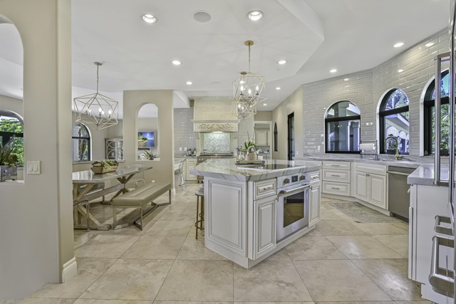 The ultimate chef's kitchen  has been tastefully remodeled and includes both Wolf gas range with griddle and Wolf induction cooktop and additional Wolf oven.