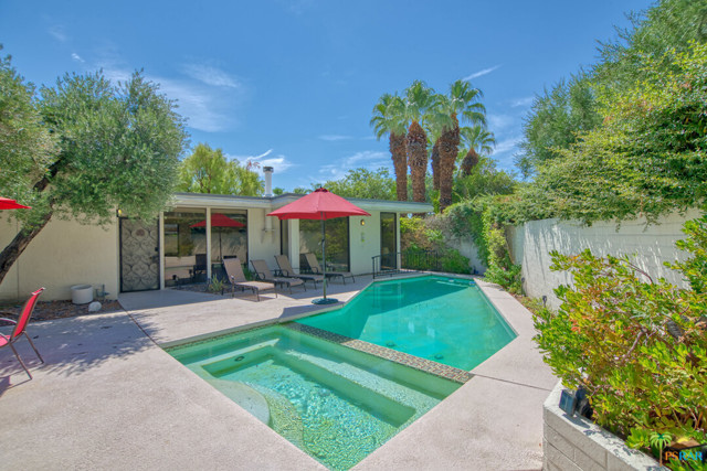 130 W Racquet Club Road Palm Springs, California Welcome to Club Condominiums and a very special three bed, two bath detached unit, the only one of its kind in the complex. Club Condominiums is famous for its architecture and Racquet Club history. This unique property came to be when units 307 and 308 were combined under one roof, resulting in a unique floor plan nestled behind gates, surrounded by a large and very private outdoor space. Enjoy your own private pool and spa in the endless Palm Springs sunshine or under the evening stars with a peaceful breeze in the air. Indoors, you'll enjoy a spacious kitchen with breakfast bar and adjacent formal dining room. Gather with family or friends in the living room with a picturesque view of the pool and spa. This condo boasts a large primary suite with direct access to the patio, plus two guest bedrooms and guest bath. Perfect as a full time residence, a weekend getaway or a short term rental property. Club Condominiums is a gated community with manicured grounds, a large community pool and spa, mountain views and plenty of Palm Springs vibe. Located just five minutes from downtown Palm Springs.
