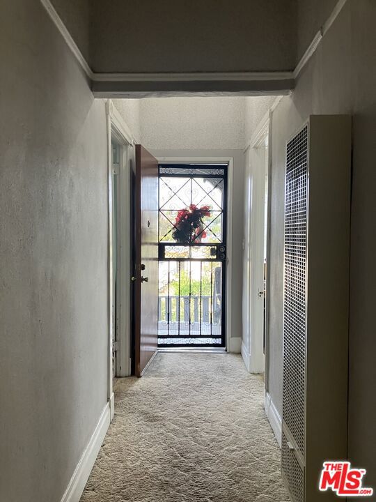 hallway with open front door