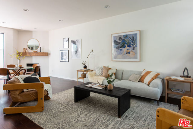1239 23rd Street 3 Santa Monica, California Stunning Santa Monica townhouse. The spacious and natural light filled split-level floor plan offers large high ceiling rooms. The open dining room/ kitchen features a new fireplace and enclosed patio. The gourmet kitchen has custom cabinets, quartz countertops, stainless steel appliances, wine fridge and garden window overlooking the patio. A newly finished powder room is conveniently located on the entry level floor. Both bedrooms have en suite remodeled bathrooms. The large primary bedroom features high ceilings, walk-in closet and en suite loft/office opening onto an expansive roof deck. All new interior doors, sliding doors, blinds and wood shutters. Full size indoor laundry, central HVAC, 2 car side-by-side and bonus room in the basement. You will be walking distance to Erewhon, Douglas Park and Milo and Olive and a stones throw from Trader Joe's and Whole Foods.